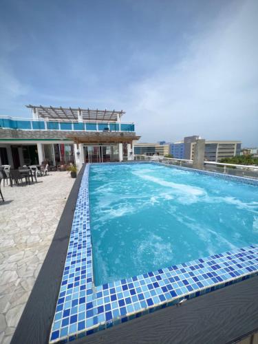 a swimming pool on the roof of a building at Hotel Dubaird in Santo Domingo