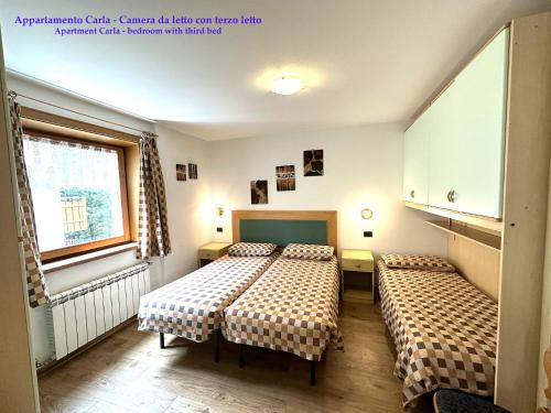 Postel nebo postele na pokoji v ubytování Appartamenti Florino di Silvestri Mariangela