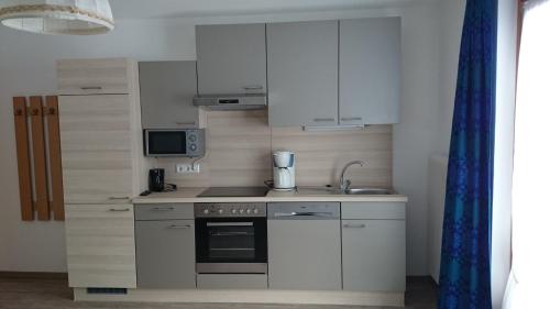Kuchyň nebo kuchyňský kout v ubytování Haus Alpina