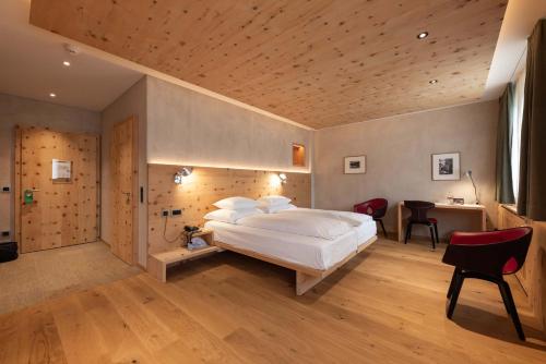 Postel nebo postele na pokoji v ubytování Hotel Albris