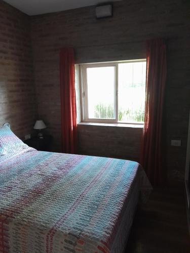 Кровать или кровати в номере La Escondida