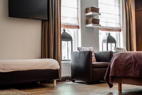 Postel nebo postele na pokoji v ubytování Hotel Veere