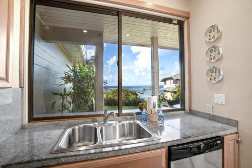 a kitchen with a sink and a large window at K B M Resorts Kapalua Bay Villas KBV 17G4 bed Ocean Front in Kapalua