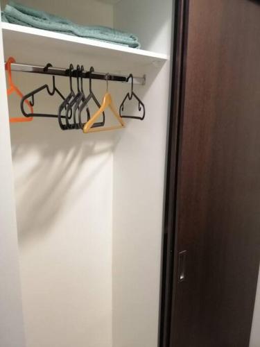 a closet with a rack with utensils in it at Dead Sea Jordan Sea View Samarah Resort Traveler Award 2024 winner in Sowayma