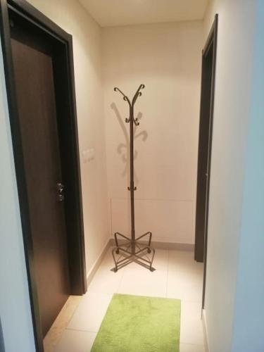 a room with a green rug next to a door at Dead Sea Jordan Sea View Samarah Resort Traveler Award 2024 winner in Sowayma