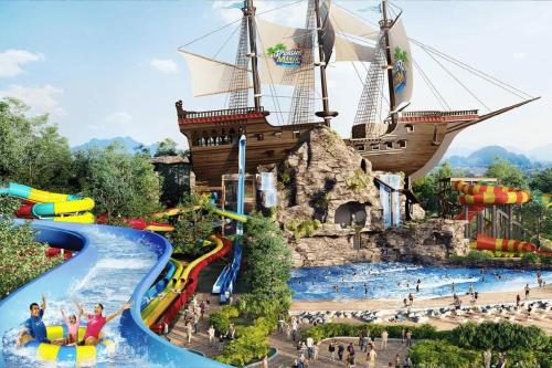 a water park with a pirate ship in the background at Alanis Suite with NETFLIX @ KLIA Sepang in Sepang