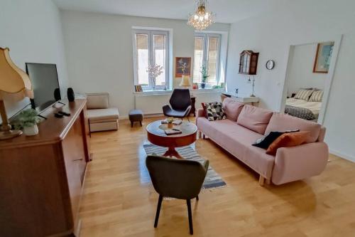 a living room with a couch and a table at Apartment Laizor in Staszów