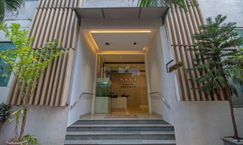 a stairway leading into a building with a store at Treebo Regency - Bund Garden, Dhole Patil Road in Pune