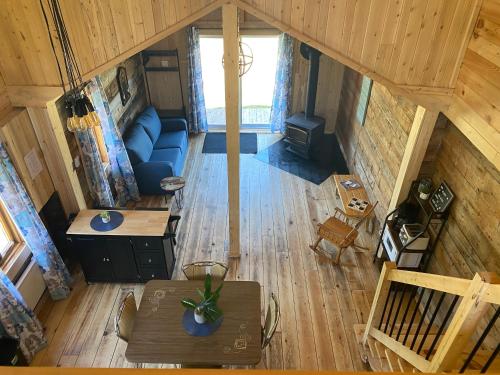 an overhead view of a living room in a tiny house at Le Hangar in La Malbaie