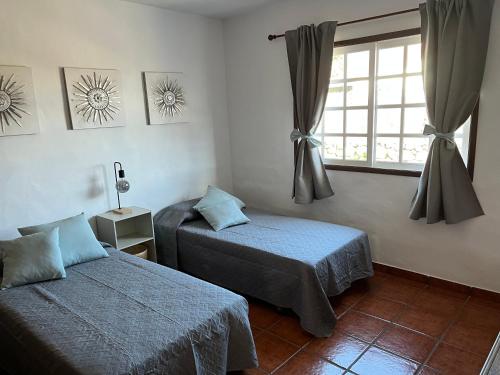 Кровать или кровати в номере Casa La Era