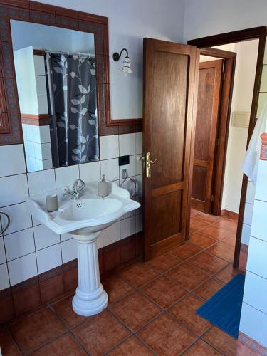 a bathroom with a sink and a mirror at Casa La Era in El Paso