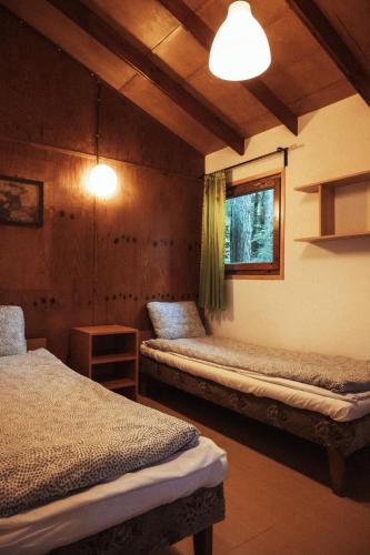 Postel nebo postele na pokoji v ubytování Ośrodek Wypoczynkowy Hartek