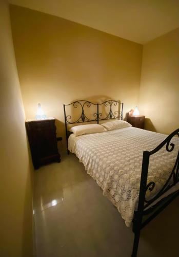 Cama ou camas em um quarto em Mariù