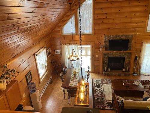 an overhead view of a living room in a log cabin at Beautiful Log Home, Lake side. in New Hope