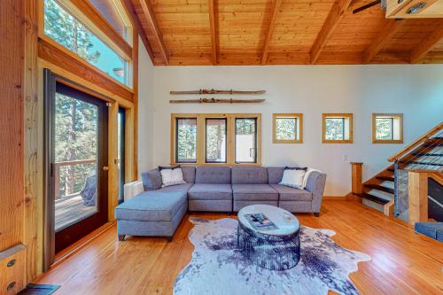a living room with a couch and a table at Epic Mountain Escape in Tahoe Vista