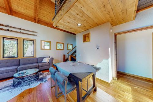 a living room with a couch and a table at Epic Mountain Escape in Tahoe Vista
