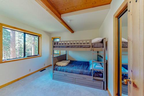 a bedroom with bunk beds in a house at Epic Mountain Escape in Tahoe Vista