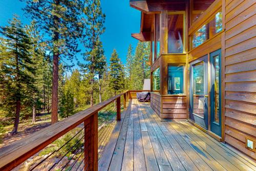 a wooden deck on a house in the woods at Epic Mountain Escape in Tahoe Vista