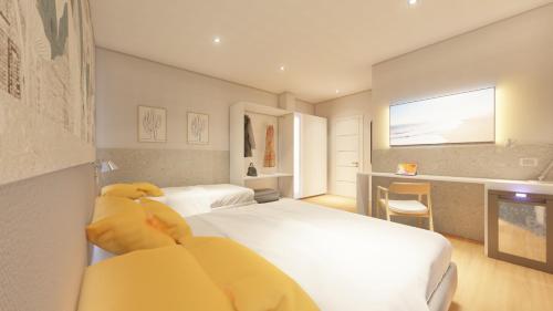 a bedroom with two beds and a teddy bear sitting on the bed at Harbor Rooms - Cala Gonone in Cala Gonone