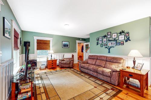 a living room with a couch and a table at Sheridans Getaway in Newry