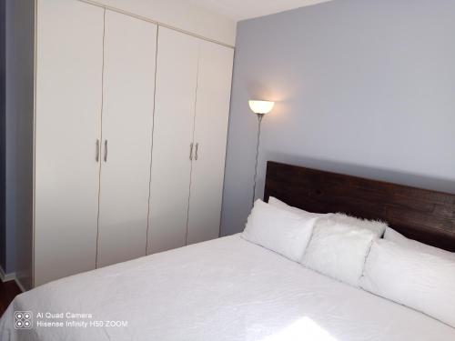 Ένα ή περισσότερα κρεβάτια σε δωμάτιο στο Waterstone Park 1 Bed