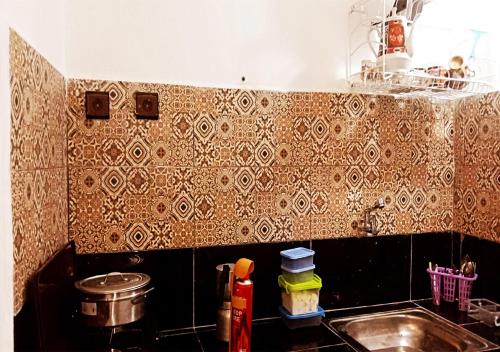 a kitchen with a sink and a counter top at Welcome to a small apartment near Ras El Lefa Beach in Safi