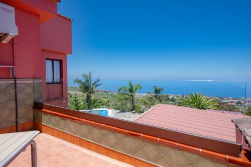 a balcony of a house with a view of the ocean at Finca El Pastel in Tacoronte