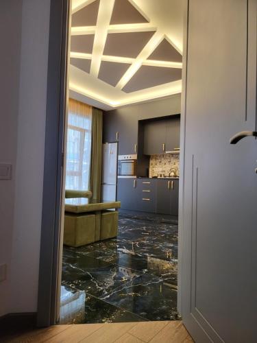 an open door to a kitchen with a counter top at Black Sea Star in Batumi