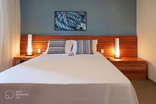 Ένα ή περισσότερα κρεβάτια σε δωμάτιο στο Santa Aldeia Hotel