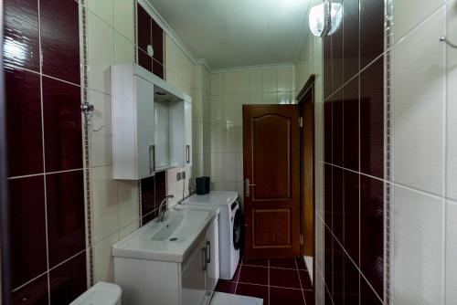 a small bathroom with a sink and a toilet at Hill House in Trabzon