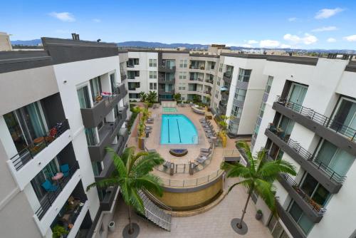 an overhead view of an apartment complex with a swimming pool at Exclusive Suites in MDR-Venice with Pool, GYM & HotTub in Los Angeles