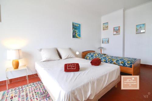 a bedroom with a bed with a red box on it at Le Grand Charles, Climatisé in Toulon