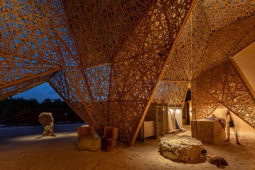 a room with a large structure with lights on it at Hotel Villas Flamingos in Holbox Island