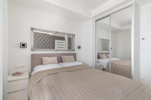 Giường trong phòng chung tại Luxury Apartman SPA Residence Hévíz