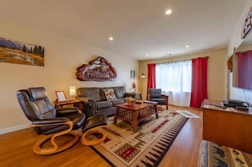 a living room with a couch and chairs and a table at Elk Meadow Cabins 11A Roosevelt Elk Suite in Orick