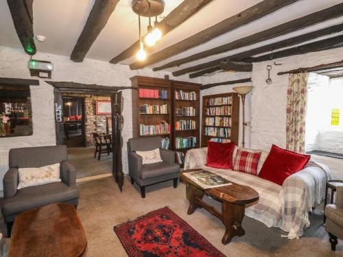 a living room with a couch and chairs and a table at The Old Church House in Newton Abbot