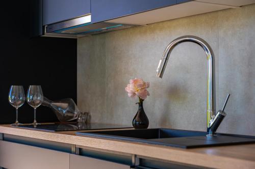a kitchen sink with a vase with a flower in it at Luxury Hidden Oasis - Greca in Lumbarda