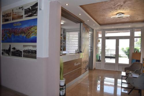 a living room with a hallway with a ceiling at Guest House Zec in Budva