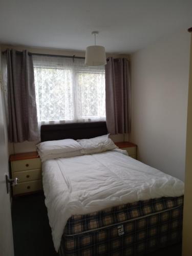 מיטה או מיטות בחדר ב-Bellaire hemsby 201