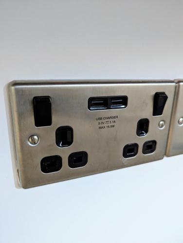 a close up of a metal switch on a white background at Cosy guest room in a family home with private bathroom and free parking in Edinburgh