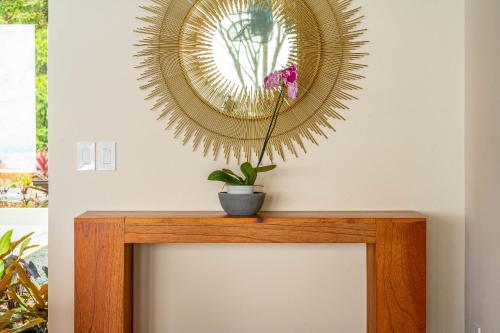 a mirror above a fireplace with a plant on it at Casa Grande del Mar - by Pura Villas in Punta Mala