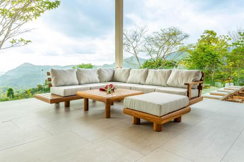 a living room with a couch and a coffee table at Casa Grande del Mar - by Pura Villas in Punta Mala
