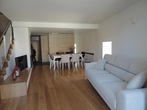 a living room with a couch and a table at Casas de Campo da Barroca in Tabosa