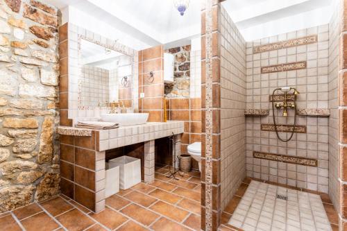 a bathroom with a sink and a toilet at Stone House Srida in Baška Voda