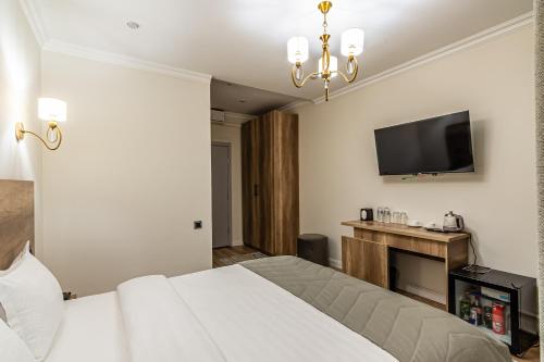 Katil atau katil-katil dalam bilik di Oscar Hotel by AG Hotels Group