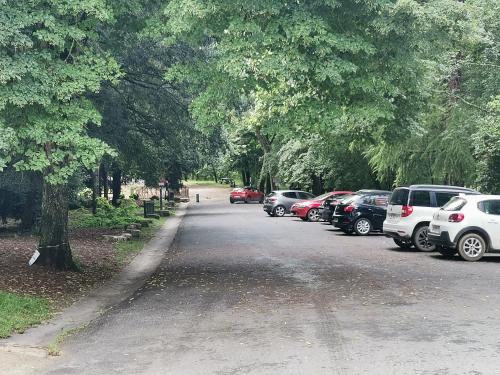 a bunch of cars parked on the side of a road at Love Room avec spa in Nérac