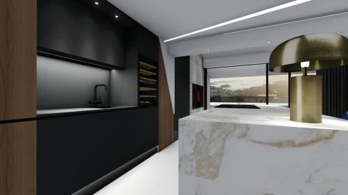 a kitchen with a marble counter and a gold lamp at Luxury Penthouse Hvar with Jacuzzi & Sea View in Hvar