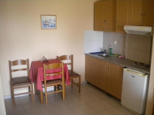 A kitchen or kitchenette at Porto Lagos Rooms