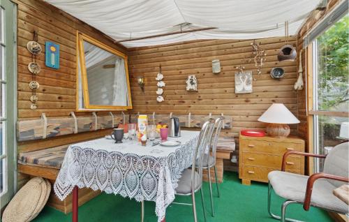 a dining room with a table and chairs at Lovely Home In Hejls With Wifi in Hejls