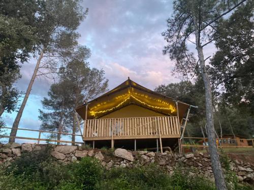 a large building with a roof with lights on it at Hostal la Salut de Terrades in Terrades